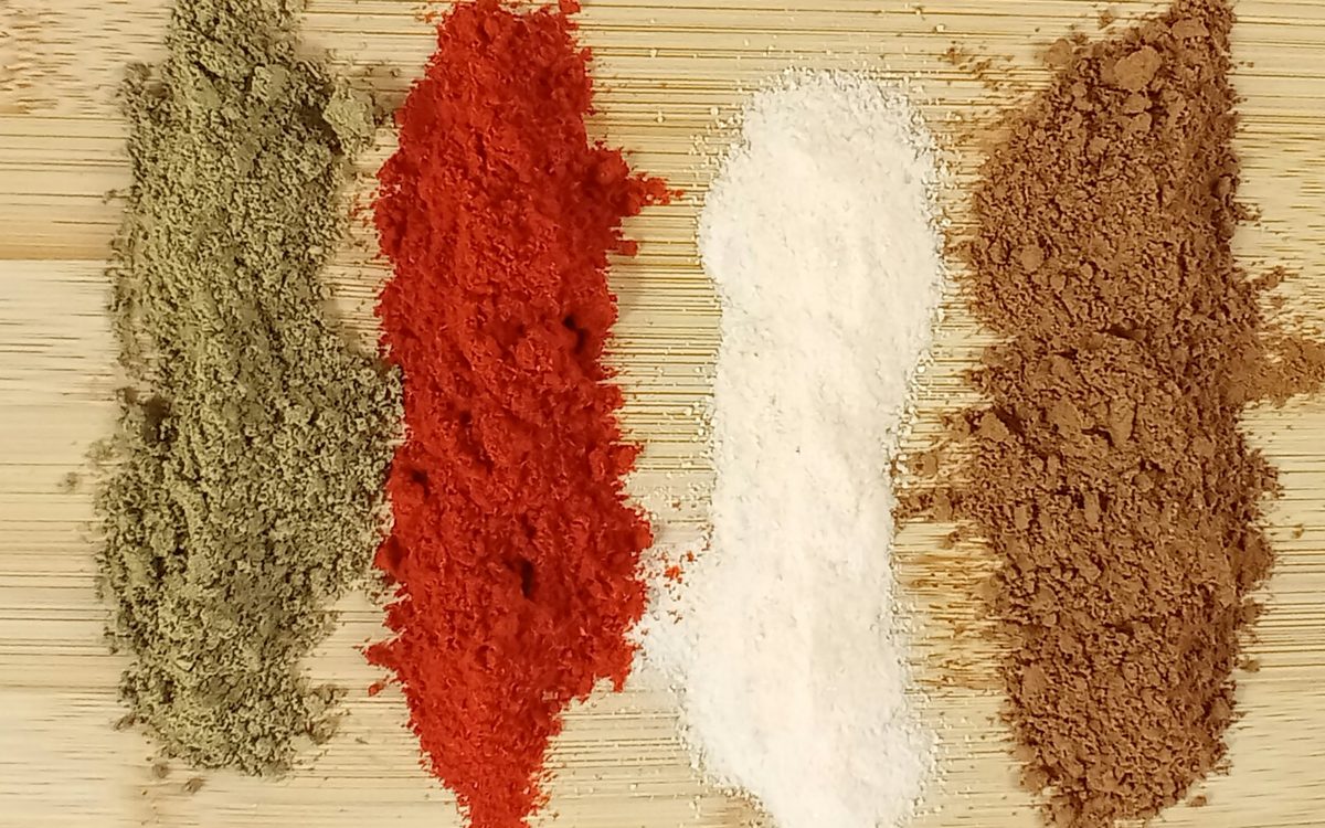 Spices lined up on a board